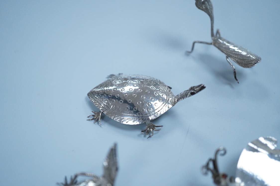 Six Thai or Malaysian white metal models of creatures, to include a Praying Mantis, height 45mm, a tortoise, a dragonfly, a butterfly, a lizard and a beetle.